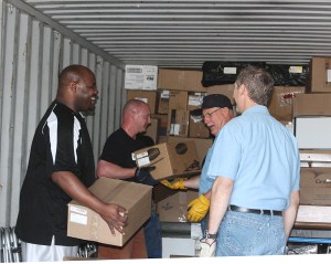 Smiling faces as they load the container for the Ukraine