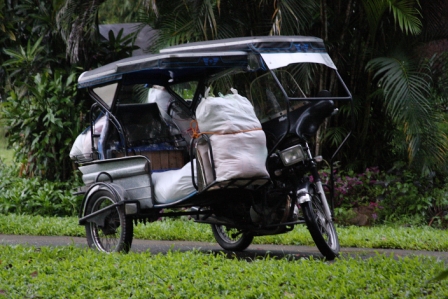 Tri-cycle delivers rice to be packed into smaller bags for families.
